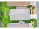 Aerial view of a home with a well-maintained roof and landscaped yard at 2317 Whisper St, The Villages, FL 32162