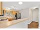 Kitchen featuring light wood cabinetry and stainless-steel appliances at 2317 Whisper St, The Villages, FL 32162