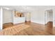 Open-concept living area showcasing wood floors and modern finishes at 2317 Whisper St, The Villages, FL 32162
