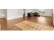 Bright living room featuring wood flooring and comfortable furnishings at 2317 Whisper St, The Villages, FL 32162