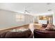 Open-concept living area with modern lighting and wood flooring at 2317 Whisper St, The Villages, FL 32162