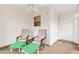 Covered porch featuring two chairs with ottomans and a ceiling fan at 2317 Whisper St, The Villages, FL 32162