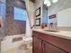 Bathroom with a tile wall accent, sink and vanity, and framed mirrors at 243 Bayou Bend Rd, Groveland, FL 34736