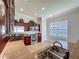 Well-lit kitchen with stainless steel appliances, granite countertops, and ample cabinet space at 243 Bayou Bend Rd, Groveland, FL 34736