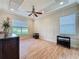 Bright living room with hardwood floors, ample natural light, and stylish decor throughout at 243 Bayou Bend Rd, Groveland, FL 34736