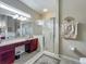 Well-lit bathroom features a vanity area, glass-enclosed shower, and modern fixtures at 25222 Laurel Valley Rd, Leesburg, FL 34748