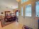 Elegant dining room with beautiful furnishings and natural light coming in from the windows at 25222 Laurel Valley Rd, Leesburg, FL 34748