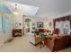 Spacious living room features large windows, comfortable seating and tiled floors at 25222 Laurel Valley Rd, Leesburg, FL 34748