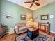 Inviting living room featuring a ceiling fan, a sitting area rug, and a sofa at 25222 Laurel Valley Rd, Leesburg, FL 34748