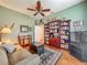 Comfortable living room featuring built in book cases and a sitting area rug at 25222 Laurel Valley Rd, Leesburg, FL 34748