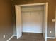 Bedroom closet with bi-fold doors and shelving unit at 2530 Hanlon Ter, The Villages, FL 32162