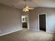 Spacious main bedroom with ceiling fan, walk-in closet and en suite bathroom at 2530 Hanlon Ter, The Villages, FL 32162