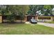 Single-story home with stone accents and large front yard at 2707 Woodbridge Ln, Orlando, FL 32808