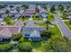 Beautiful aerial view of house highlighting lush landscaping and established community at 2799 Privada Dr, The Villages, FL 32162