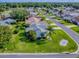 Aerial view of a landscaped property highlighting lawn, mature trees and established neighborhood at 2799 Privada Dr, The Villages, FL 32162