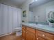 Cozy bathroom with a shower and tub combination, and wooden vanity at 2799 Privada Dr, The Villages, FL 32162