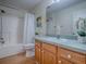 Bathroom featuring a shower and tub combination with decorative floral and landscape accents at 2799 Privada Dr, The Villages, FL 32162