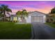 Charming home featuring a lush lawn, well-manicured landscaping, and a clean, freshly painted exterior at 2799 Privada Dr, The Villages, FL 32162