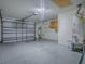 Spacious garage with ample storage space and an automatic door at 2799 Privada Dr, The Villages, FL 32162