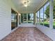 Enclosed lanai featuring tile flooring with sliding doors offering views of the neighborhood at 2799 Privada Dr, The Villages, FL 32162