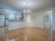Bright living and dining space with modern light fixture and open view to kitchen at 2799 Privada Dr, The Villages, FL 32162