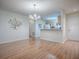 Inviting living space with modern accents and wood-look floors, adjacent to kitchen at 2799 Privada Dr, The Villages, FL 32162