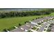Beautiful community aerial view showcases green space and a tranquil lake in the background at 29810 Anahid Dr, Leesburg, FL 34748