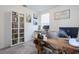 Functional office space with custom bookcase and desk and natural light at 29810 Anahid Dr, Leesburg, FL 34748
