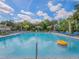 Inviting community pool featuring crystal clear water and comfortable lounge chairs at 29810 Anahid Dr, Leesburg, FL 34748