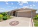 Charming single-Gathering home with an attached two-car garage and well manicured landscaping at 3097 Bureau Path, The Villages, FL 32163