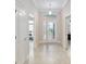 Welcoming foyer with neutral tones and tile flooring, leading to the rest of the home at 3097 Bureau Path, The Villages, FL 32163