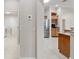 Hallway with view of kitchen and laundry room at 3097 Bureau Path, The Villages, FL 32163