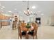 Open-concept floor plan with dining area, living room, and kitchen, perfect for entertaining at 3097 Bureau Path, The Villages, FL 32163