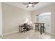 Inviting home office featuring tiled floors, a desk, and large window with shutter-style blinds at 3097 Bureau Path, The Villages, FL 32163