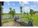Cozy patio seating area overlooking the lush green golf course and water view at 3097 Bureau Path, The Villages, FL 32163