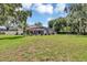 Enjoy the large backyard, with lush lawn and a screened-in patio and pool, perfect for entertaining at 34231 Shadewood Cir, Leesburg, FL 34788