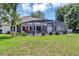 Relaxing backyard with a screened-in patio and a sparkling pool for endless enjoyment at 34231 Shadewood Cir, Leesburg, FL 34788