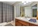 Well-maintained bathroom with neutral countertop, vanity, and shower-tub combo at 34231 Shadewood Cir, Leesburg, FL 34788