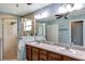 Spacious bathroom featuring a double vanity, walk-in shower, and ample storage at 34231 Shadewood Cir, Leesburg, FL 34788