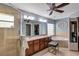 Large bathroom with a double vanity, tile shower, and a soaking tub at 34231 Shadewood Cir, Leesburg, FL 34788