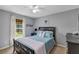 Cozy bedroom featuring a comfortable bed, soft lighting, and a serene ambiance at 34231 Shadewood Cir, Leesburg, FL 34788