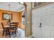 Bright dining area showcasing a stylish chandelier, and doorway entrance at 34231 Shadewood Cir, Leesburg, FL 34788