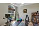 Bright exercise room featuring a ceiling fan, mirror, and workout equipment at 34231 Shadewood Cir, Leesburg, FL 34788