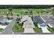 Aerial view of a lovely home in a community situated alongside a lush golf course at 3466 Smedley Rd, The Villages, FL 32163