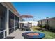 Enjoy the outdoors on this backyard patio with stylish seating and a cozy fire pit at 3466 Smedley Rd, The Villages, FL 32163