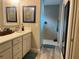 Bathroom featuring a single sink vanity and a glass-enclosed walk-in shower at 3466 Smedley Rd, The Villages, FL 32163