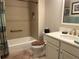 Bright bathroom featuring tub with tile surround and white vanity at 3466 Smedley Rd, The Villages, FL 32163
