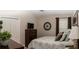 Bedroom featuring neutral walls, a flat screen TV, and patterned bedding at 3466 Smedley Rd, The Villages, FL 32163