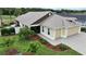 Home with a three car garage and well maintained landscaping at 3466 Smedley Rd, The Villages, FL 32163