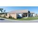 Beautiful exterior side view of home with a privacy fence and well-maintained lawn and patio at 3466 Smedley Rd, The Villages, FL 32163